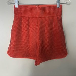 Anti-hero orange sparkle shorts